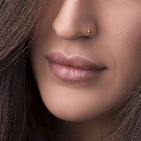 gold nose rings.